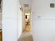 Clean hallway with tile flooring leading to bathroom at 8495 Cristobal Ave, North Port, FL 34287