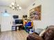 Living room with a brown leather couch and lots of natural light at 8495 Cristobal Ave, North Port, FL 34287