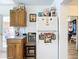 Kitchen with wood cabinets, white appliances, and a breakfast bar at 8495 Cristobal Ave, North Port, FL 34287