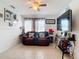 Living room features a comfy couch and large TV at 8495 Cristobal Ave, North Port, FL 34287