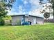 Rear view of house with large backyard at 8495 Cristobal Ave, North Port, FL 34287