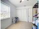 Bright bedroom featuring tile floors and a spacious closet at 8495 Cristobal Ave, North Port, FL 34287