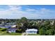 Aerial view of a residential neighborhood with single-Gathering homes and lush landscaping at 8495 Cristobal Ave, North Port, FL 34287