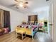 Bedroom with ceiling fan and yellow sleigh bed at 8495 Cristobal Ave, North Port, FL 34287