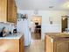 Kitchen features wood cabinets and a butcher block island at 8495 Cristobal Ave, North Port, FL 34287
