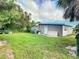 House exterior with a large backyard at 8495 Cristobal Ave, North Port, FL 34287
