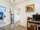 Bright dining area with wood floors and access to kitchen at 8495 Cristobal Ave, North Port, FL 34287