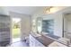 Bright bathroom with double vanity, toilet and exterior access at 20340 Zelda Ave, Port Charlotte, FL 33952