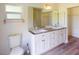 Bathroom with double vanity and updated fixtures at 20340 Zelda Ave, Port Charlotte, FL 33952