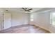 Spacious bedroom with ceiling fan and large windows at 20340 Zelda Ave, Port Charlotte, FL 33952