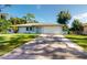 Newly renovated home with a modern exterior and driveway at 20340 Zelda Ave, Port Charlotte, FL 33952