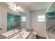Updated bathroom with teal shower and modern vanity at 20340 Zelda Ave, Port Charlotte, FL 33952