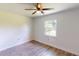 Bright bedroom with large window and ceiling fan at 20340 Zelda Ave, Port Charlotte, FL 33952