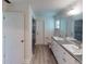 Clean bathroom with double vanity, walk in shower and toilet at 20340 Zelda Ave, Port Charlotte, FL 33952