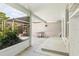Screened patio with concrete flooring and a small table at 8516 Riverside Dr, Punta Gorda, FL 33982