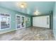 Main bedroom with light walls and access to a bathroom at 8516 Riverside Dr, Punta Gorda, FL 33982