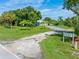 House exterior with a large yard and park nearby at 8516 Riverside Dr, Punta Gorda, FL 33982