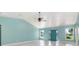 Large living room with vaulted ceiling, light wood floors, and ample natural light at 8516 Riverside Dr, Punta Gorda, FL 33982