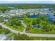 Aerial view of canal front property surrounded by lush vegetation at 8516 Riverside Dr, Punta Gorda, FL 33982