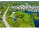 Bird's-eye view of a house on a canal with a large lot, and neighboring homes visible at 8516 Riverside Dr, Punta Gorda, FL 33982