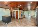 Updated kitchen featuring wood cabinets, tile floor, and island at 8516 Riverside Dr, Punta Gorda, FL 33982