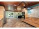Modern kitchen with wood cabinets, stainless steel appliances, and tile floor at 8516 Riverside Dr, Punta Gorda, FL 33982
