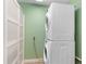 Stackable washer and dryer in a well-lit laundry room at 8516 Riverside Dr, Punta Gorda, FL 33982