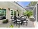 Screened patio with outdoor furniture, perfect for relaxing at 8516 Riverside Dr, Punta Gorda, FL 33982