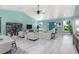 Open living area with vaulted ceiling, light wood floors, and neutral decor at 8516 Riverside Dr, Punta Gorda, FL 33982