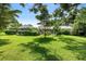 View of home from the backyard showcasing the screened porch at 8516 Riverside Dr, Punta Gorda, FL 33982