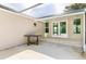 Covered patio with screened enclosure, perfect for outdoor relaxation at 8516 Riverside Dr, Punta Gorda, FL 33982