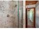 Shower with patterned tile and glass enclosure at 8516 Riverside Dr, Punta Gorda, FL 33982