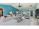 Spacious living room with vaulted ceilings and light-colored furniture at 8516 Riverside Dr, Punta Gorda, FL 33982