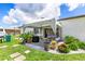 Relaxing backyard patio with seating and landscaping at 5104 Chaves Cir, Port Charlotte, FL 33948