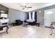 Living room with tiled floors, couch and electric fireplace at 5104 Chaves Cir, Port Charlotte, FL 33948