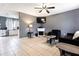 Spacious living room with fireplace and kitchen view at 5104 Chaves Cir, Port Charlotte, FL 33948