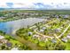 Aerial view of a waterfront home in a residential community at 5104 Chaves Cir, Port Charlotte, FL 33948