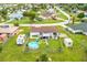 Backyard aerial view showing a home with a pool, shed, and patio at 5104 Chaves Cir, Port Charlotte, FL 33948