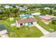 Aerial view of a single-Gathering home with a fenced backyard, pool, and shed at 5104 Chaves Cir, Port Charlotte, FL 33948