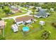 Backyard aerial view showing a home with a pool, shed, and patio at 5104 Chaves Cir, Port Charlotte, FL 33948