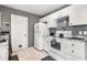 White kitchen with granite countertops and stainless steel appliances at 5104 Chaves Cir, Port Charlotte, FL 33948