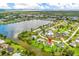 Aerial view of a waterfront home in a residential community at 5104 Chaves Cir, Port Charlotte, FL 33948