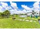 Large backyard with a pool, fire pit, and RV parking at 5104 Chaves Cir, Port Charlotte, FL 33948