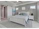 Main bedroom with white bed and coastal decor, sliding barn door at 2239 Cornelius Blvd, Port Charlotte, FL 33953