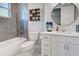 Bathroom with white vanity, toilet and blue mosaic tile at 2239 Cornelius Blvd, Port Charlotte, FL 33953