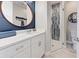 Bathroom with white vanity, toilet and glass shower at 2239 Cornelius Blvd, Port Charlotte, FL 33953