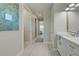 Bathroom with white vanity and a walk-in shower at 2239 Cornelius Blvd, Port Charlotte, FL 33953