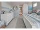 Main bedroom with white dresser, king-size bed, and water views at 2239 Cornelius Blvd, Port Charlotte, FL 33953
