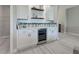 Built-in bar with wine cooler and ample storage at 2239 Cornelius Blvd, Port Charlotte, FL 33953