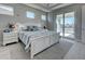 Main bedroom with king-size bed, water view, and white dresser at 2239 Cornelius Blvd, Port Charlotte, FL 33953